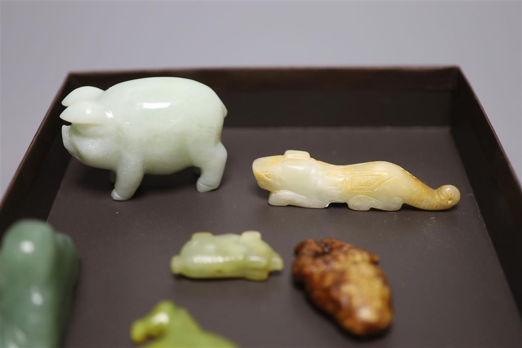 Six Chinese jade and hardstone animal carvings, two dragon belt hooks, a rams head and a soapstone seal, 10cm